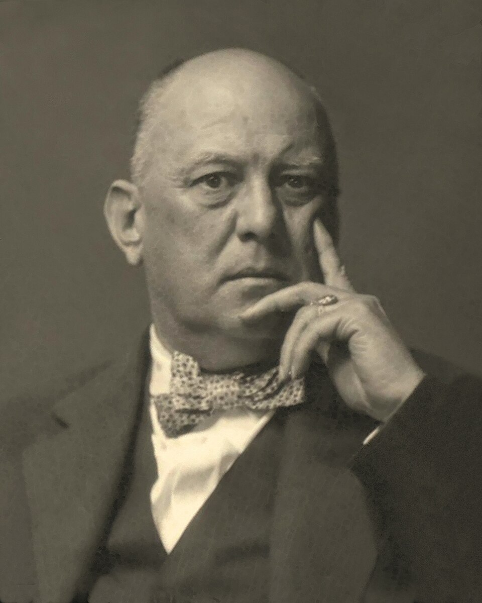 Photograph of Aleister Crowley in a thoughtful pose.